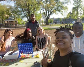 Six Students on a blanket in Monroe Park